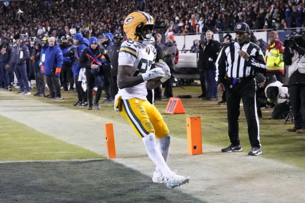 Jan 10, 2026; Chicago, IL, USA; Green Bay Packers wide receiver Romeo Doubs (87) runs after the catch for a touchdown against the Chicago Bears during the first half of an NFC Wild Card Round game at Soldier Field. Mandatory Credit: David Banks-Imagn Images