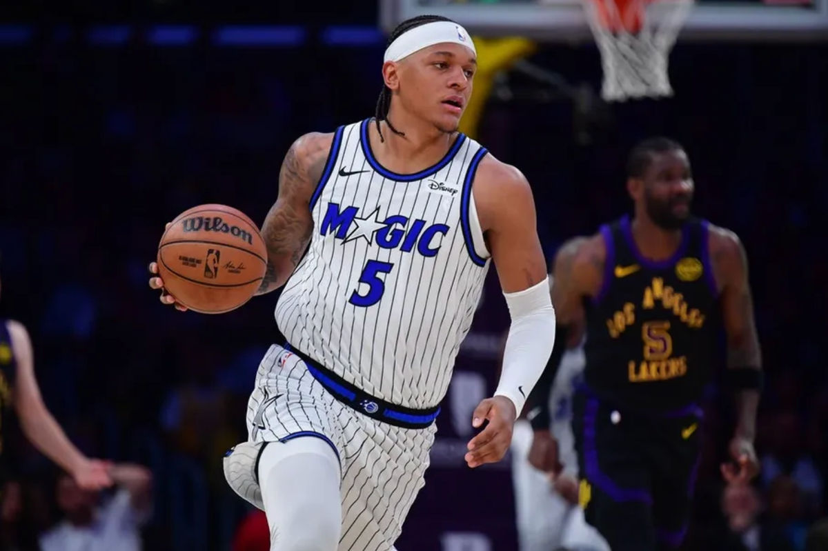 Feb 24, 2026; Los Angeles, California, USA; Orlando Magic forward Paolo Banchero (5) moves the ball up court against the Los Angeles Lakers during the first half at Crypto.com Arena. Mandatory Credit: Gary A. Vasquez-Imagn Images