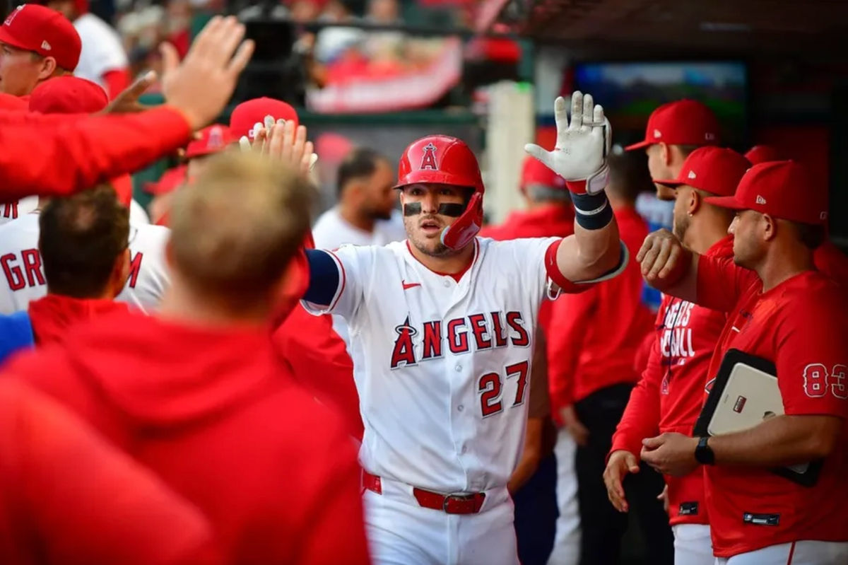 May 5, 2026; Anaheim, California, USA; Los Angeles Angels center fielder Mike Trout (27) is greeted after hitting a solo home run against the Chicago White Sox during the first inning at Angel Stadium. Mandatory Credit: Gary A. Vasquez-Imagn Images