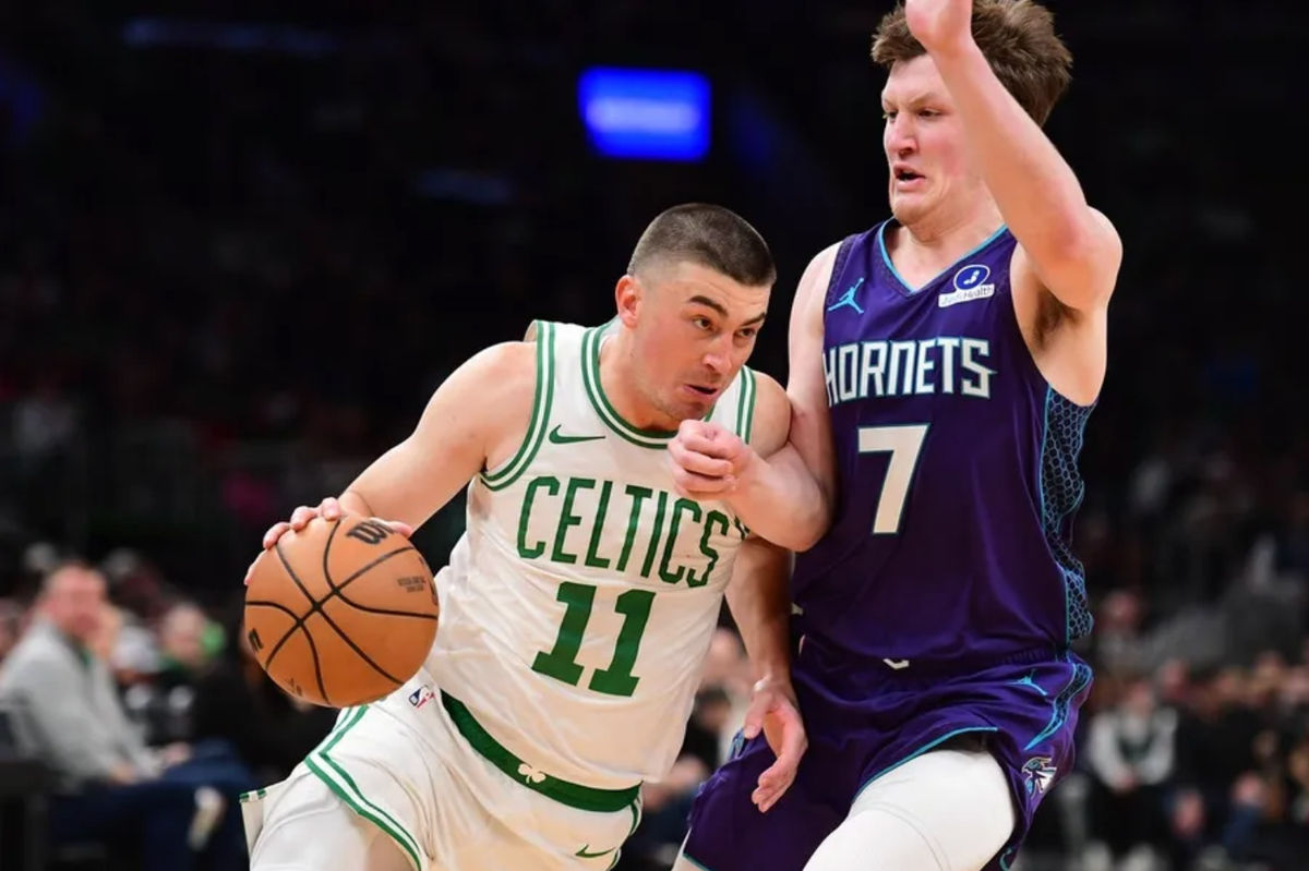 Mar 4, 2026; Boston, Massachusetts, USA; Boston Celtics guard Payton Pritchard (11) drives to the basket while Charlotte Hornets guard Kon Knueppel (7) defends during the first half at TD Garden. Mandatory Credit: Bob DeChiara-Imagn Images