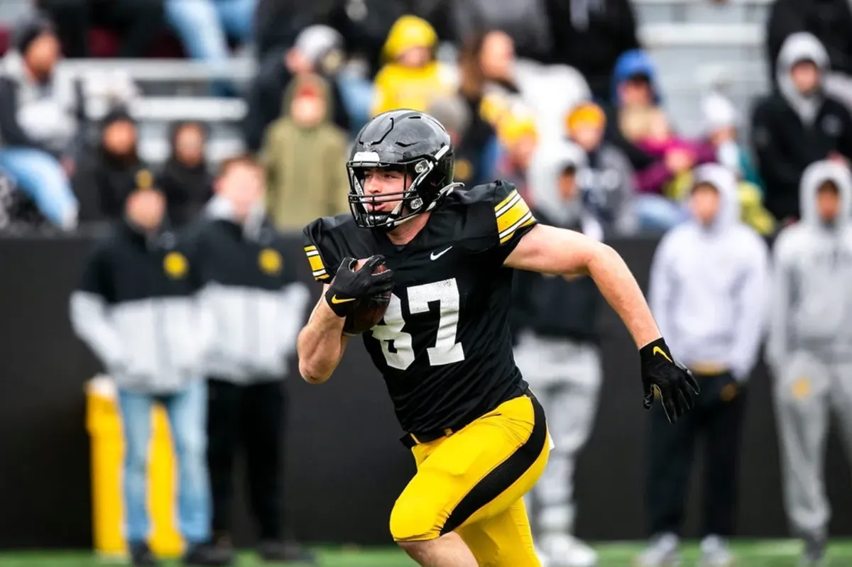 Iowa tight end Addison Ostrenga (87) runs for extra yards after a catch during the Hawkeyes' final spring NCAA football practice, Saturday, April 22, 2023, at Kinnick Stadium in Iowa City, Iowa.