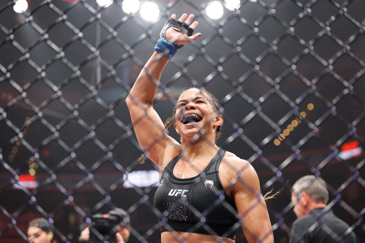 Jul 18, 2026; Oklahoma City, Oklahoma, USA; Dione Barbosa (blue gloves) celebrates after the fight against Anna Melisano (red gloves) during UFC Fight Night at Paycom Center. Mandatory Credit: Alonzo Adams-Imagn Images