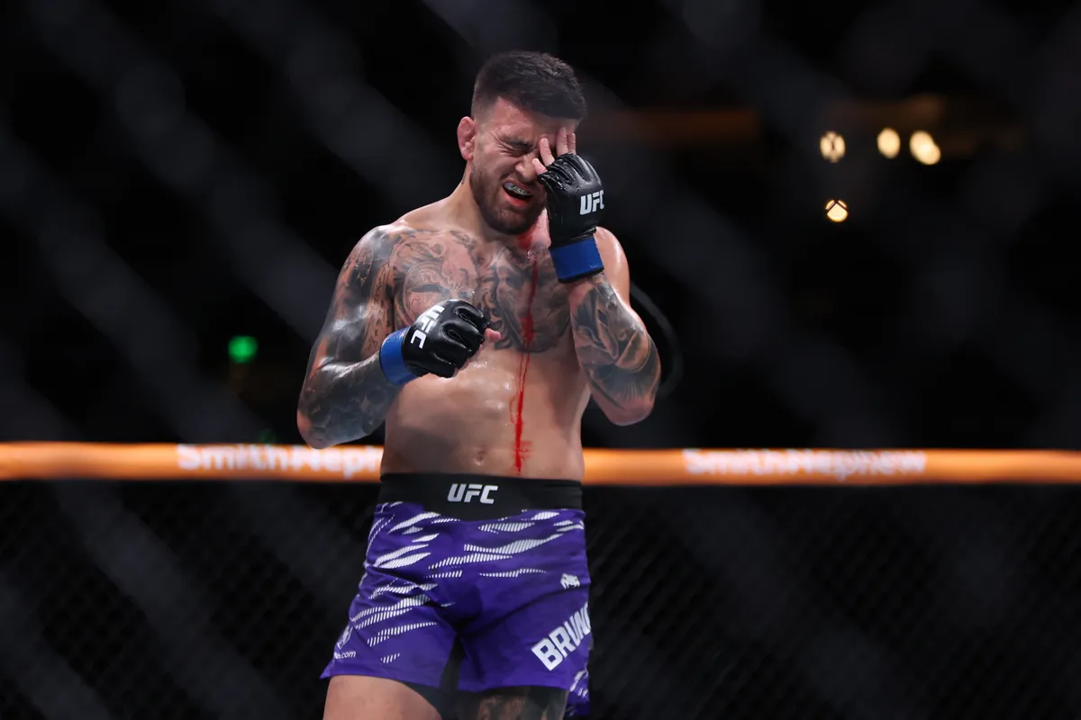 Jun 14, 2025; Atlanta, Georgia, UNITED STATES; Mansur Abdul-Malik (red gloves) fights Cody Brundage (blue gloves) during UFC Fight Night at State Farm Arena. Mandatory Credit: Brett Davis-Imagn Images